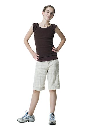 simsearch:640-02773530,k - Girl standing with hands on hips Stock Photo - Premium Royalty-Free, Code: 640-02773308
