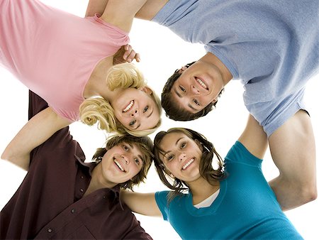 Low level view of four people smiling Stock Photo - Premium Royalty-Free, Code: 640-02773486
