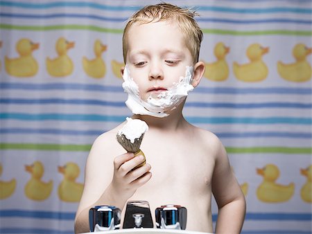shaving kids boys - Boy shaving in bathroom Stock Photo - Premium Royalty-Free, Code: 640-02773636