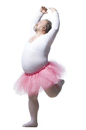 dancing ballerina man - Obese man in tutu dancing and smiling Stock Photo - Premium Royalty-Free, Code: 640-02773773