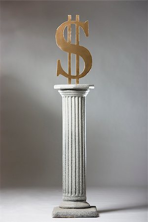 dollar signs - money on a pedestal Stock Photo - Premium Royalty-Free, Code: 640-02947702