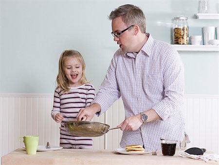 pancake - father and daughter making breakfast Stock Photo - Premium Royalty-Free, Code: 640-02948057