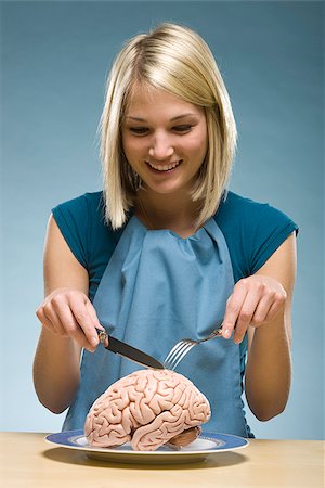 woman eating "brain food" Stock Photo - Premium Royalty-Free, Code: 640-02948175