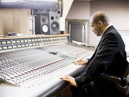 man working in a recording studio Stock Photo - Premium Royalty-Free, Code: 640-02948847