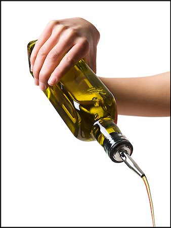 pourer - hand pouring olive oil Stock Photo - Premium Royalty-Free, Code: 640-02949431