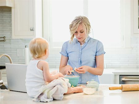 family computer kitchen - mother and baby girl cooking in the kitchen Stock Photo - Premium Royalty-Free, Code: 640-02949789