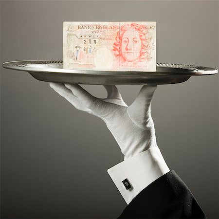 british pound on a platter Stock Photo - Premium Royalty-Free, Code: 640-02950329