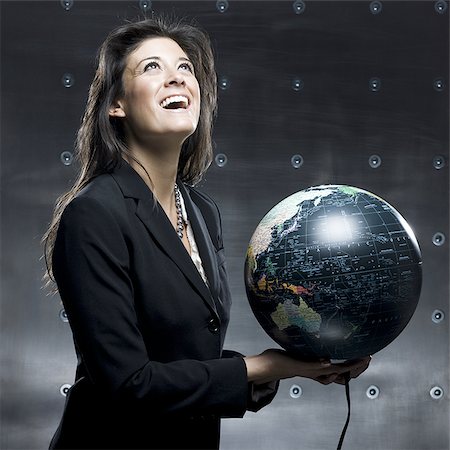 businesswoman with a globe in her hands Stock Photo - Premium Royalty-Free, Code: 640-02950840