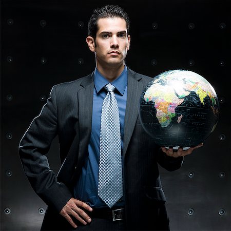 businessman holding a globe Stock Photo - Premium Royalty-Free, Code: 640-02950887