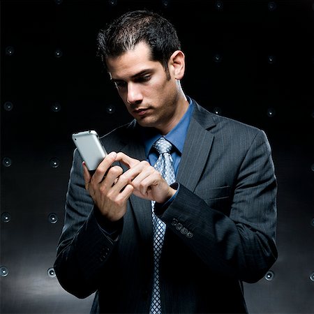 businessman using a cell phone Stock Photo - Premium Royalty-Free, Code: 640-02950909