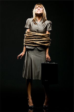 businesswoman all tied up with ropes Stock Photo - Premium Royalty-Free, Code: 640-02952212