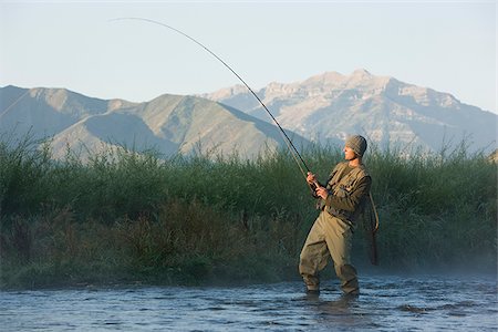 fly fisherman fishing in a mountain river Stock Photo - Premium Royalty-Free, Code: 640-02952366