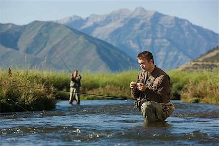 fly fisherman fishing in a mountain river Stock Photo - Premium Royalty-Free, Code: 640-02952384