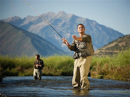 fly fisherman fishing in a mountain river Stock Photo - Premium Royalty-Free, Code: 640-02952380