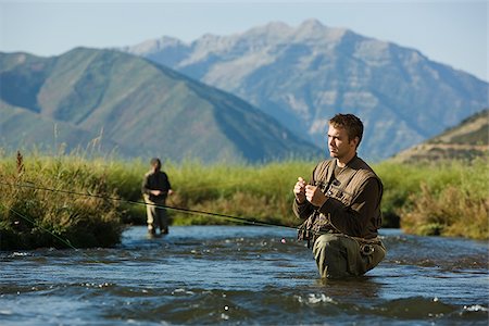 fly fisherman fishing in a mountain river Stock Photo - Premium Royalty-Free, Code: 640-02952381