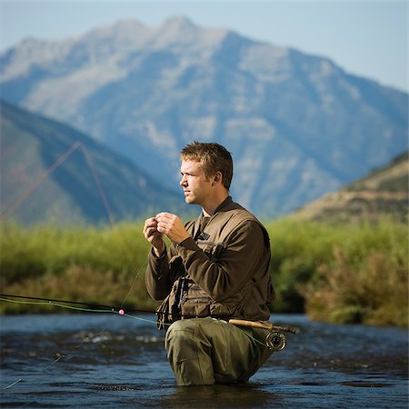 fly fisherman fishing in a mountain river Stock Photo - Premium Royalty-Free, Code: 640-02952382