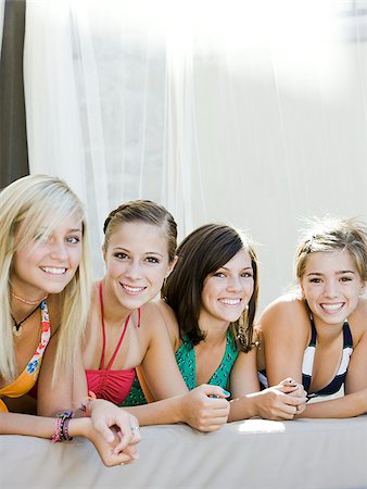 teenagers in a poolside cabana Stock Photo - Premium Royalty-Free, Code: 640-02952499