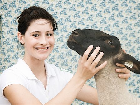 sheep happy pets - young woman with a sheep Stock Photo - Premium Royalty-Free, Code: 640-02952491