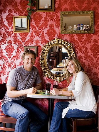 young couple eating together at a diner Stock Photo - Premium Royalty-Free, Code: 640-02952803