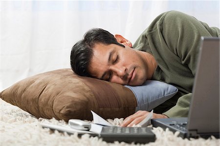 Man sleeping on cushion Stock Photo - Premium Royalty-Free, Code: 640-03255775