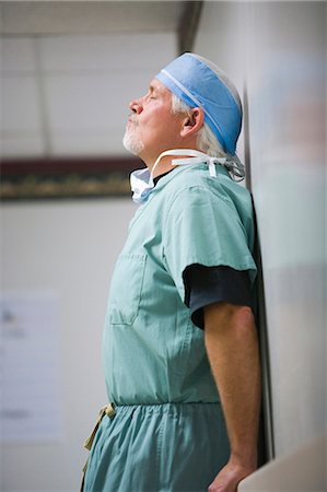 Surgeon leaning in scrubs Stock Photo - Premium Royalty-Free, Code: 640-03255796