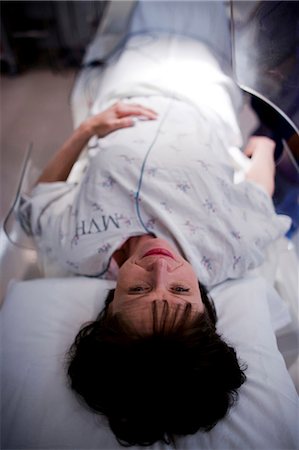Woman on hospital bed from above Stock Photo - Premium Royalty-Free, Code: 640-03255804