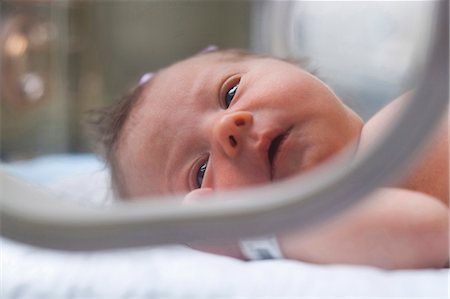 Newborn girl in incubator Stock Photo - Premium Royalty-Free, Code: 640-03255800