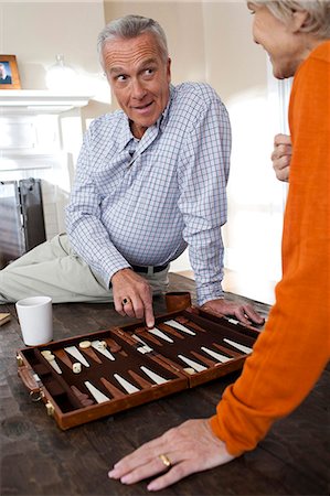 Mature couple playing backgammon Stock Photo - Premium Royalty-Free, Code: 640-03255860