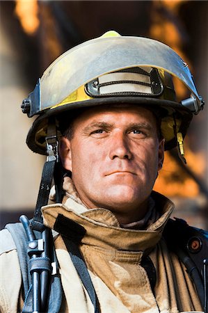 Closeup of fire fighter at work Stock Photo - Premium Royalty-Free, Code: 640-03255888
