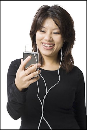 simsearch:640-03265333,k - Woman with mp3 player smiling Stock Photo - Premium Royalty-Free, Code: 640-03255964