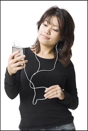 simsearch:640-03265333,k - Woman with mp3 player smiling Stock Photo - Premium Royalty-Free, Code: 640-03255963