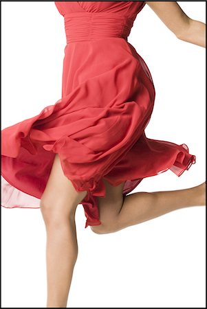 dance white background - Woman in red dress dancing Stock Photo - Premium Royalty-Free, Code: 640-03255972