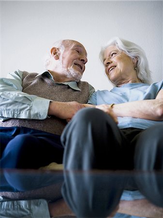 Mature couple sitting on the couch Stock Photo - Premium Royalty-Free, Code: 640-03256063