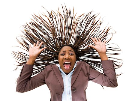 pumped up - Woman with braided hair and wild expression Stock Photo - Premium Royalty-Free, Code: 640-03256161