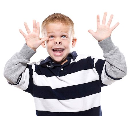 Boy (4-5) pressing face and hands on glass, portrait Stock Photo - Premium Royalty-Free, Code: 640-03256350