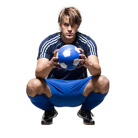 soccer player holding ball - Portrait en studio de joueur de football tient ballon Photographie de stock - Premium Libres de Droits, Code: 640-03256491