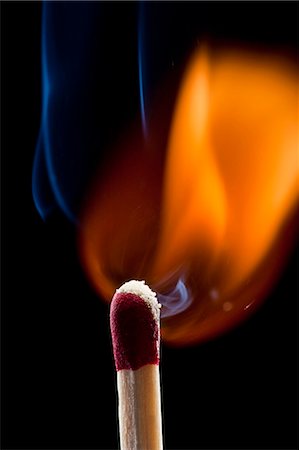 fire hazard - Burning match against black background Stock Photo - Premium Royalty-Free, Code: 640-03257010