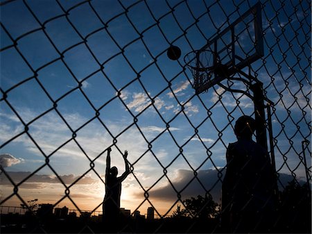 USA, Utah, Salt Lake City, two young men playing street basketball Stock Photo - Premium Royalty-Free, Code: 640-03257087