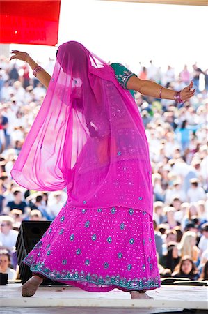 USA, Utah, Spanish Fork, rear view of mid adult dancer in traditional clothing performing on stage Stock Photo - Premium Royalty-Free, Code: 640-03257168