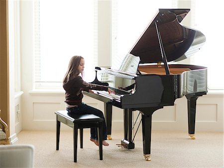 USA, Utah, Alpine, girl (8-9) practicing piano Stock Photo - Premium Royalty-Free, Code: 640-03257221