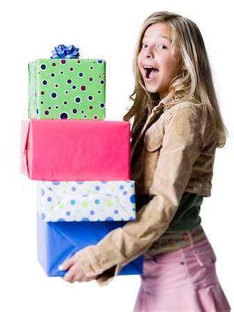 preteen open mouth - Girl (10--11) holding a stack of presents, portrait Stock Photo - Premium Royalty-Free, Code: 640-03257263