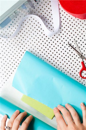 polka dot gift wrap - USA, California, San Francisco, young woman wrapping gift Stock Photo - Premium Royalty-Free, Code: 640-03257294