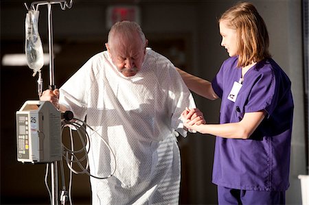 USA, Utah, Provo, female nurse helping senior man in hospital Stock Photo - Premium Royalty-Free, Code: 640-03257397