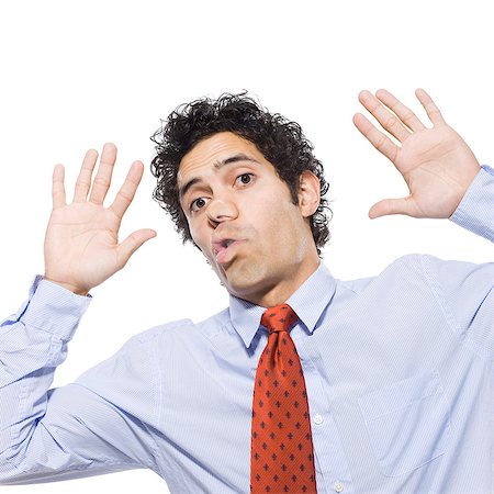 Man with face pressed up against window, studio shot Stock Photo - Premium Royalty-Free, Code: 640-03257501