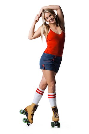 rollerskating - Portrait of young woman roller skating Stock Photo - Premium Royalty-Free, Code: 640-03257533