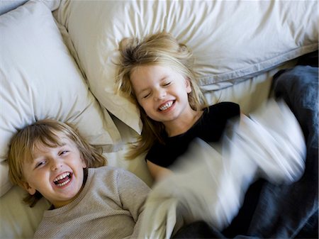 simsearch:640-06963757,k - USA, Utah, Provo, Brother and sister (2-5) playing in bed Stock Photo - Premium Royalty-Free, Code: 640-03257578