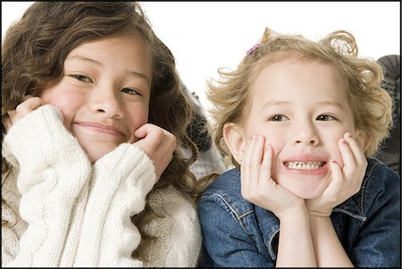 simsearch:640-03263432,k - Sisters posing and smiling Stock Photo - Premium Royalty-Free, Code: 640-03258169