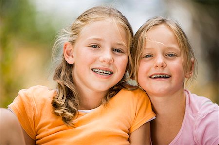 simsearch:640-03263432,k - Two girls outside with braces Stock Photo - Premium Royalty-Free, Code: 640-03259350