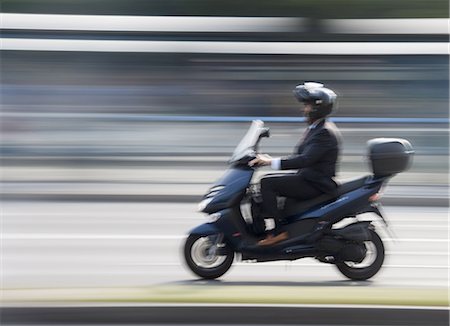 Blurred teenage boy on a bike Stock Photo - Premium Royalty-Free, Code: 640-03259544