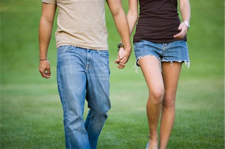 romantic boy and girl - A young couple holding hands Stock Photo - Premium Royalty-Free, Code: 640-03259855